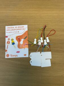 versier gelukspoppetje